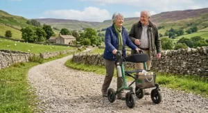 All terrain rollator with seat and back rest navigating a countryside gravel path