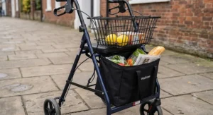 Close up of the best three wheel rollator showing its spacious storage bag and removable shopping basket.