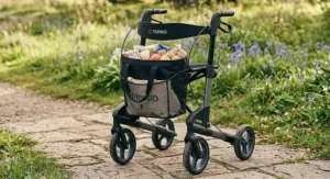 A stylish four-wheel rollator showing the spacious under-seat shopping bag storage attachment